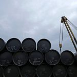 File photo of a worker preparing to transport oil pipelines to be laid for Pengerang Gas Pipeline Project in Johor