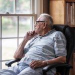 Day Dreaming Elderly Senior Man Staring Through Hazy Window