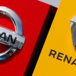 FILE PHOTO: The logos of car manufacturers Renault and Nissan are seen in front of dealerships of the companies in Reims