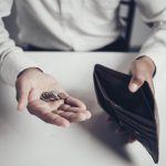 businessman saving money,Man carrying a wallet in hand, the doll